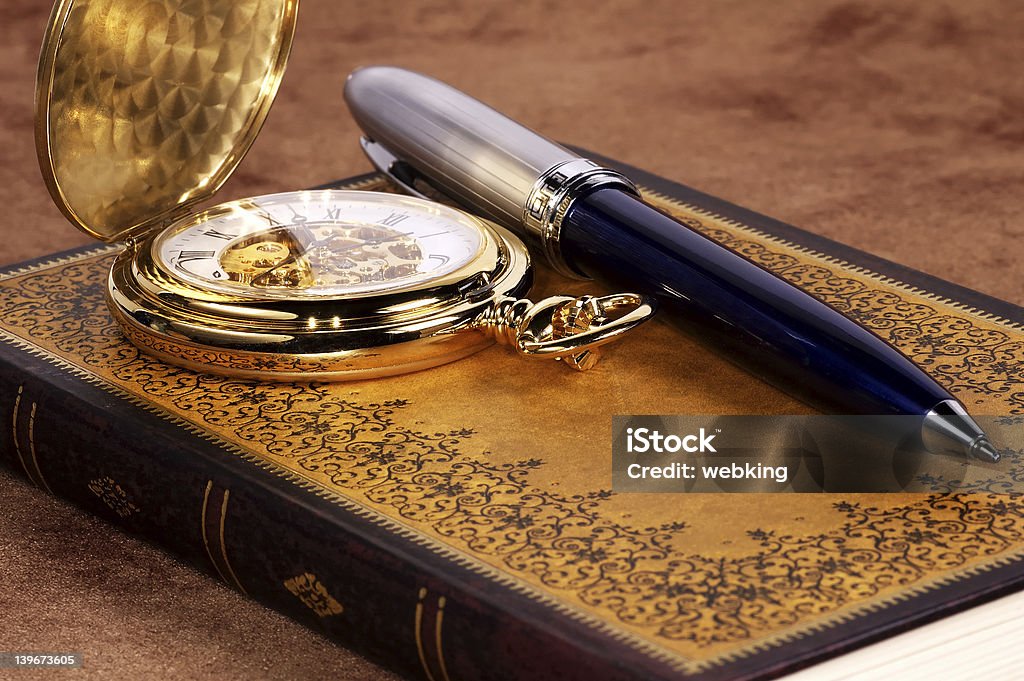 Book and Watch Photo of a Book and a Pocket Watch. Pocket Watch Stock Photo