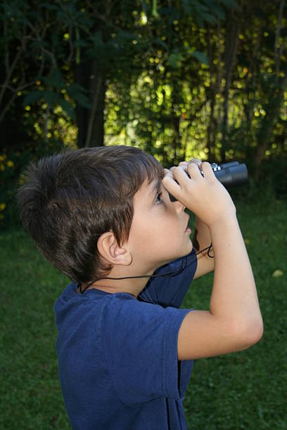 utilizzando il binocolo - binoculars watching optical instrument closed foto e immagini stock