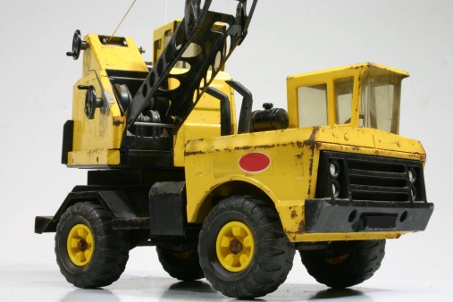 vintage toy crane truck on a white background
