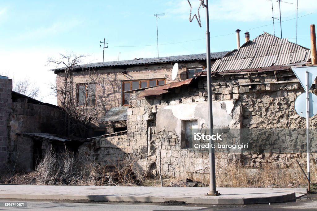Ruined house in Gyumri, Armenia Ruined stone house on random street in Gyuimri, Armenia. March 2022. Armenia - Country Stock Photo