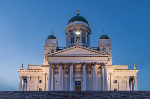 Helsinki, Finland - May 11th 2022: Helsinki Cathedral is an international landmark of Finnish capital. It's even more prominent when illuminated in the evening.