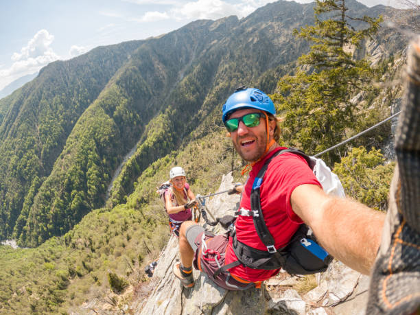 istock Couple taking selfies during a via ferrata climb 1396740962