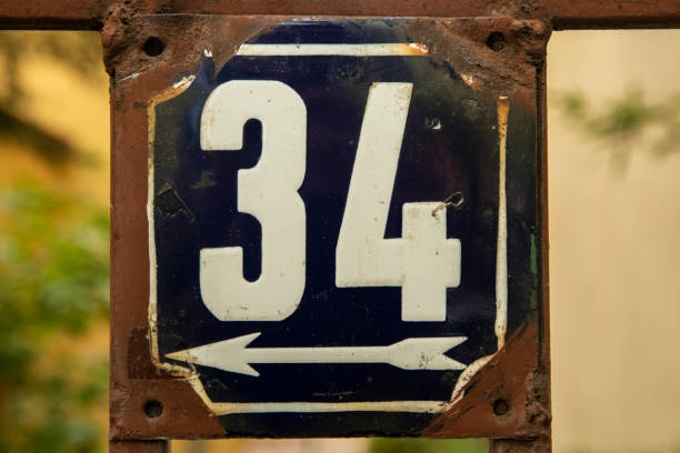 istock Weathered enamelled plate number 34 1396740970