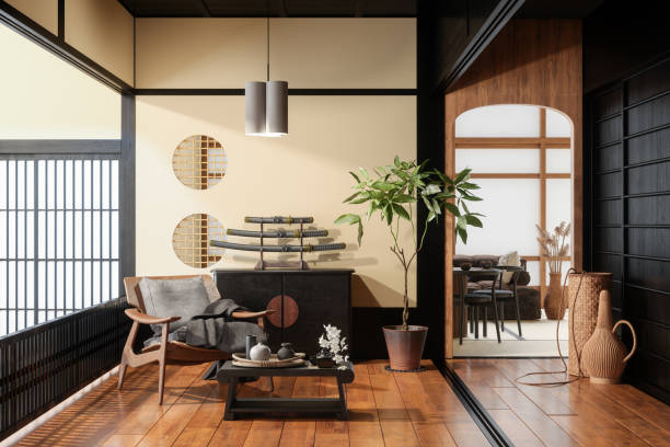 интерьер гостиной в японском стиле с креслом, журнальным столиком, горшечным растением, обеденным столом и диваном - традиционная восточная культура стоковые фото и изображения