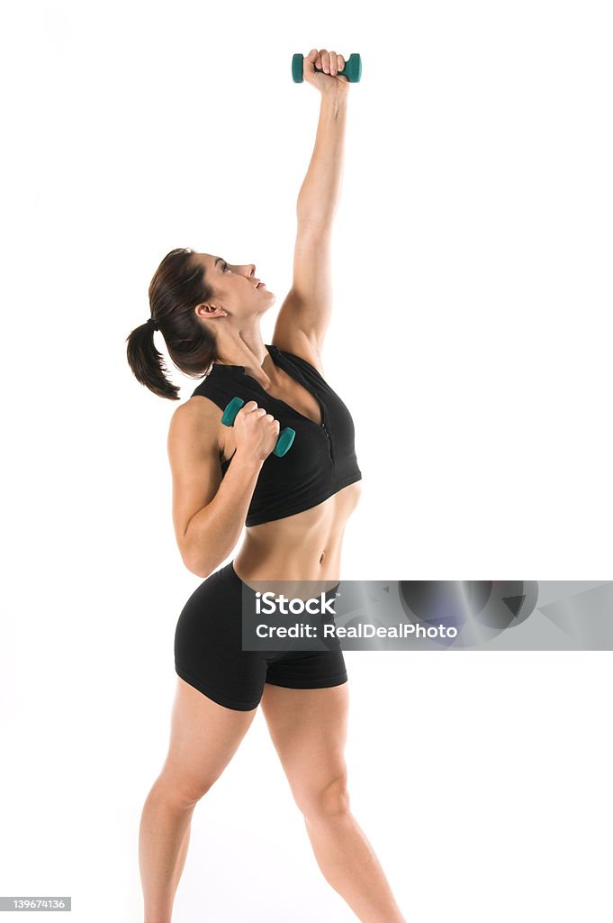 Free Weight Work Out Fit and trim woman working out with dumbells Above Stock Photo