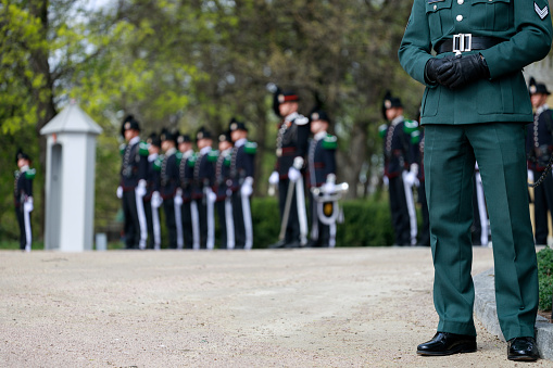 Riga, Latvia – May 4, 2020: Guard of honor. And flowers are put by the monument as it's the day when 20 years ago Latvia proclaimed its independence from the USSR. There are so few people in the streets because of Covid-19 quarantine.