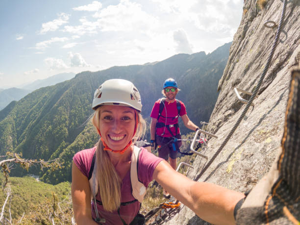 istock Couple taking selfies during a via ferrata climb 1396741596
