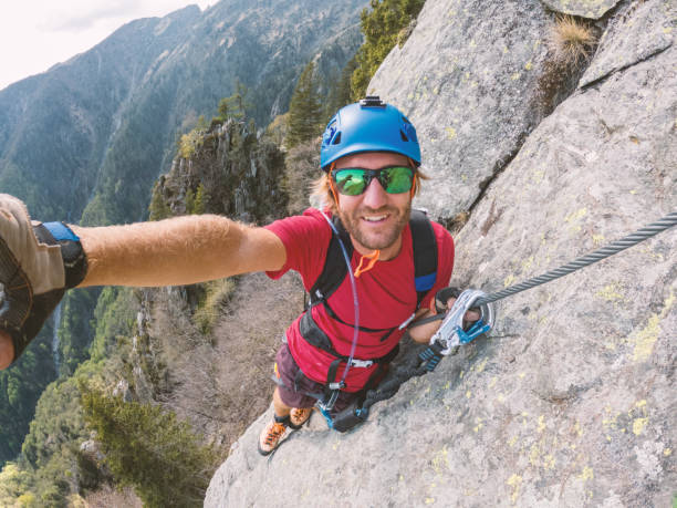 istock Man taking selfie on a Via Ferrata route 1396741721