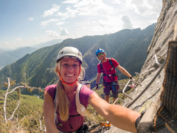 istock Couple taking selfies during a via ferrata climb 1396741753