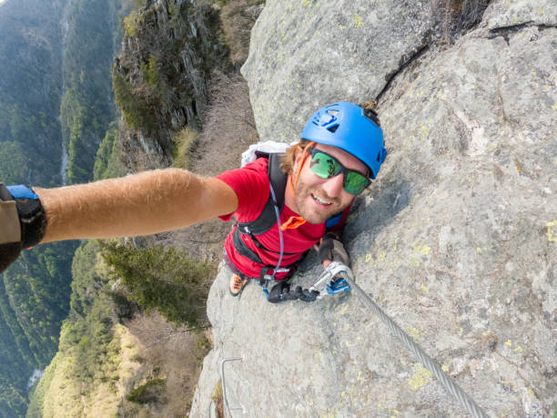 istock Man taking selfie on a Via Ferrata route 1396741755