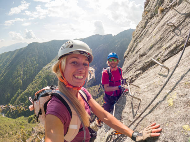 istock Couple taking selfies during a via ferrata climb 1396741955