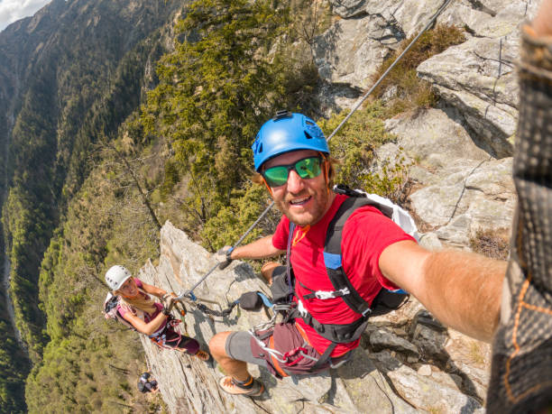 istock Couple taking selfies during a via ferrata climb 1396742030