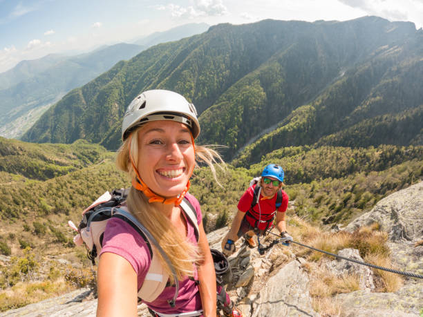 istock Couple taking selfies during a via ferrata climb 1396742080