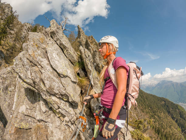 istock Young woman climbs Via Ferrata 1396742763