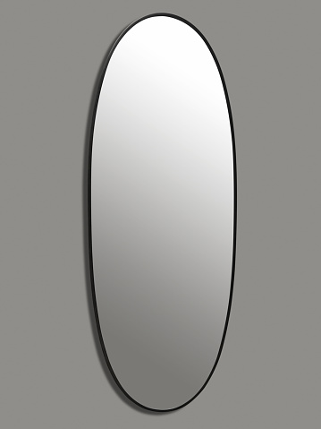 Front view full length mirror hanging on the wall (Clipping Path)