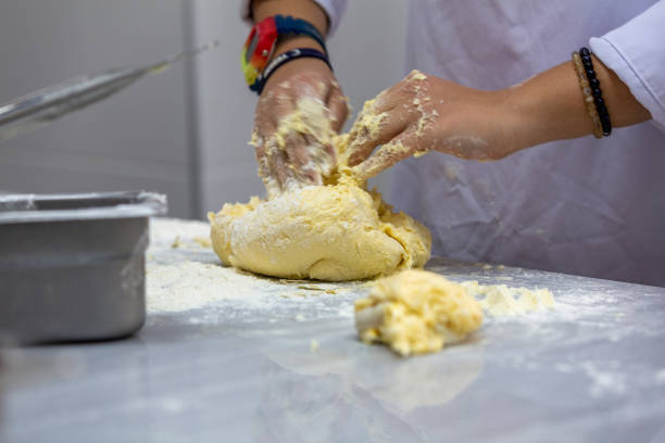 istock A cook kneading dough for pies. 1396742991