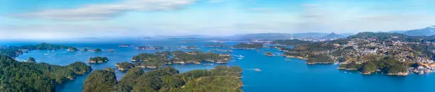 Long exposure photography of a panorama bird's-eye view of the Kujkushima seascape with islands that lie off sasebo famous for its saw-toothed coast part of Saikai National Park in Kyushu.