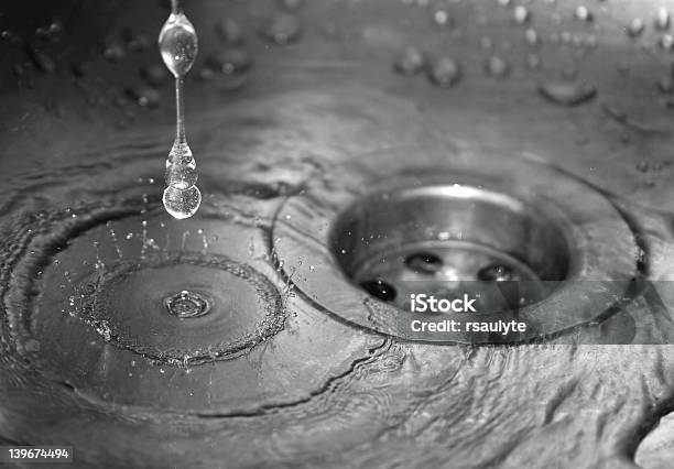 Closeup Of Water Running Into Sink And Draining Away Stock Photo - Download Image Now