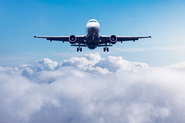 istock Flight of the passenger plane above the clouds. 1396747904