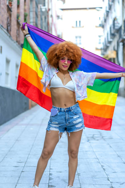 istock proud lesbian with her gay pride flag 1396748037
