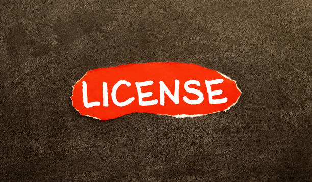 istock word license written on notepad and white background. High quality photo. 1396749046