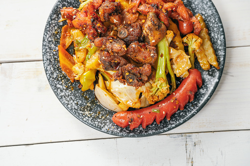 Close up of warm salad with beef and vegetables