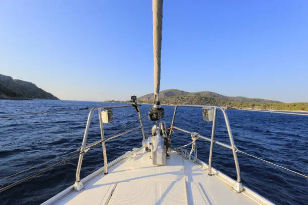 Bow of sailing yacht, view from a sailboat in Greece