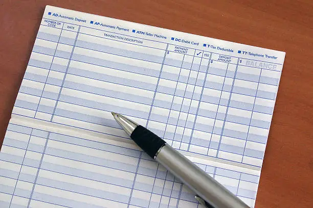 A blank checkbook register shown with pen