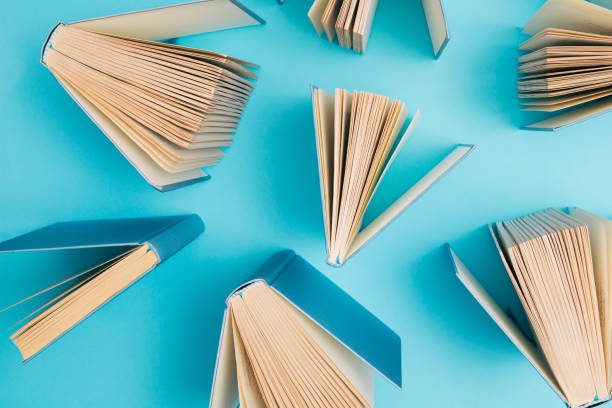 istock Creative pattern made of pastel blue books on bright blue background. Education, knowledge or Nature concept. Flat lay. 1396756468