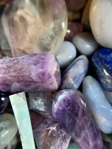 Mixture of purple and blue healing crystals: amethyst, larimar, blue lace agate, fluorite, angelite, lapis lazuli, calcite