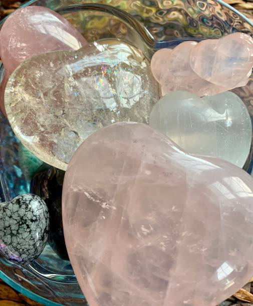 istock Carved crystal hearts: rose quartz, clear quartz, selenite, snowflake obsidian 1396756519