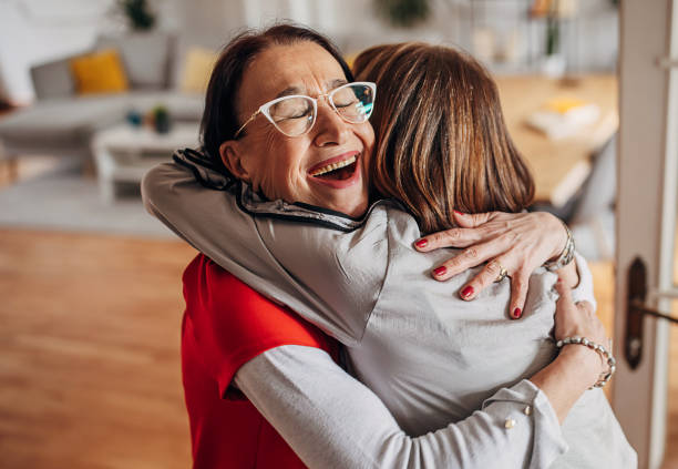 istock Female friends hugging 1396757206