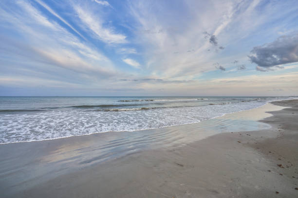 istock Vibrant Sunset with a Dramatic Sky at Cocoa Beach in Central Florida USA 1396757208