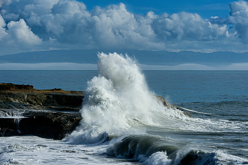 Turbulent ocean waves crashing on sandy beach, off the California Coast, after a pacific coast storm passed through the area.

Taken at Santa Cruz, California, USA