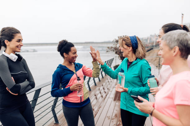 istock Group of women taking a break during their outdoor training 1396761321