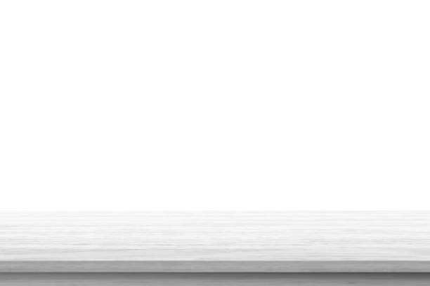 istock Empty white wooden table top isolated on white background 1396761459