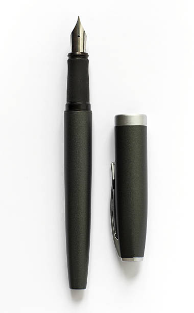 istock A black fountain pen uncapped on a white table 139676183