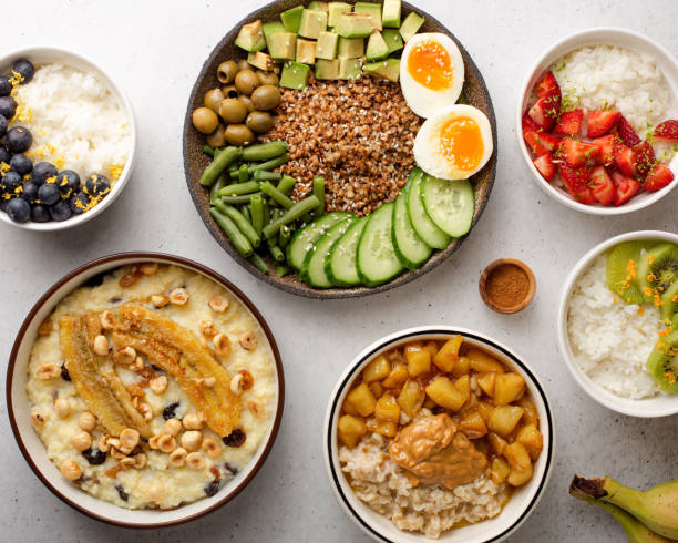 bowls of porridge. healthy breakfast - healthy eating food rice high angle view imagens e fotografias de stock