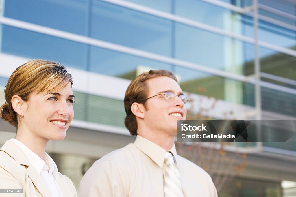 business team Business team stands together as they look out in success 20-29 Years Stock Photo
