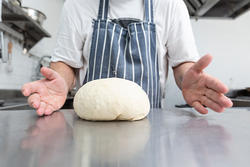 Chef preparing dough for bread