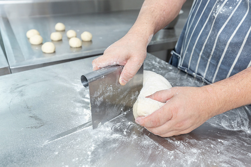 Chef preparing flatbread dough