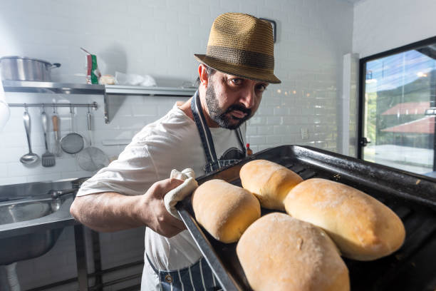 Relaxed chef with fresh breads