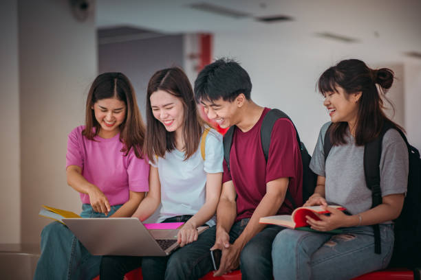 istock Asian group of student using laptop, digital tablet together. Lifestyle with information technology gadget education or social network concept. 1396767509