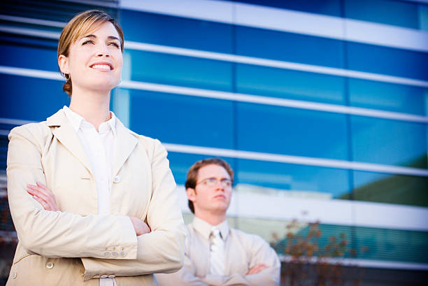 istock Two business people outside a building with folded arms 139676891