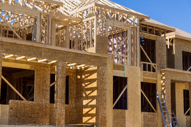 istock New home construction framing of a house 1396772519