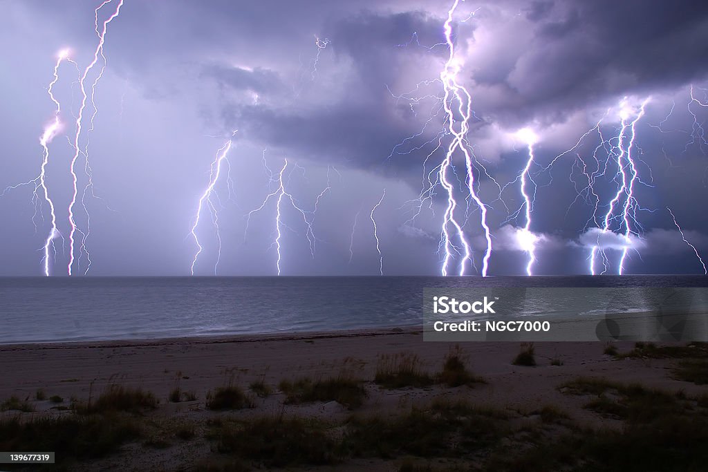 Lightning show This is a combination of five following 30 second exposures.  The view crosses the beach and the Gulf of Mexico from Anna Maria Island, Florida, USA. Lightning Stock Photo