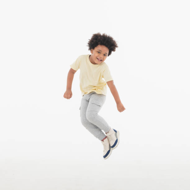 istock Happy Child jumping in the air. 1396779580