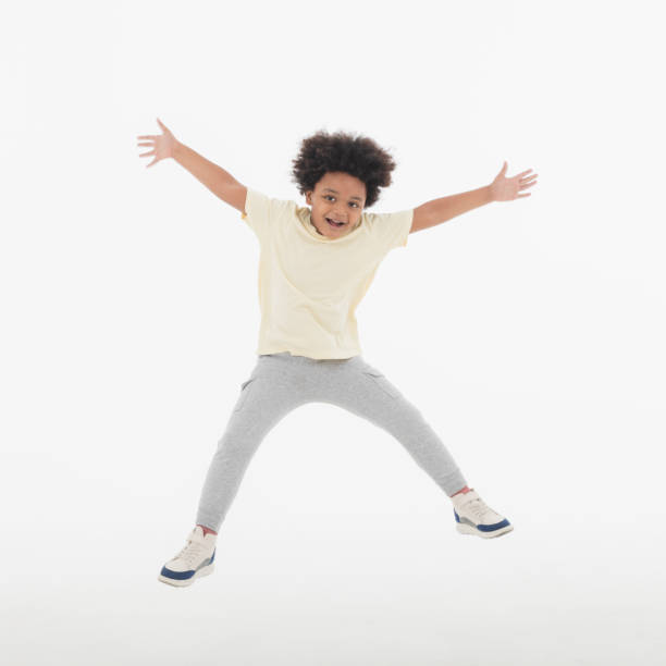 istock Happy Child jumping in the air. 1396779581