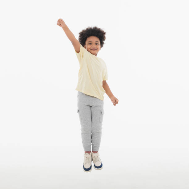 istock Happy Child jumping in the air. 1396779634