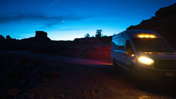 istock Van driving at night in Moab Utah, USA 1396781700